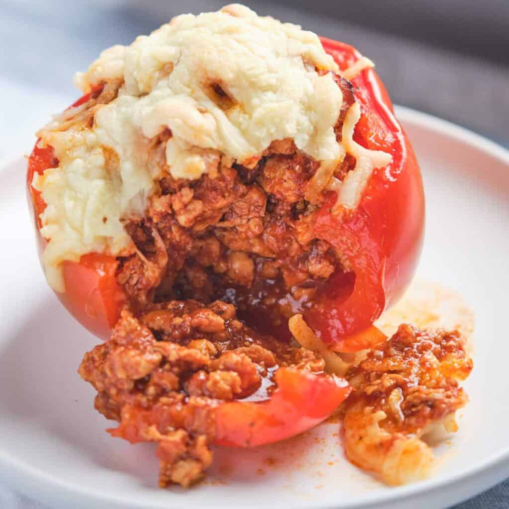 turkey stuffed red bell pepper topped with cheese