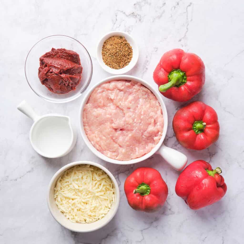 ingredients for turkey stuffed peppers on marble countertop