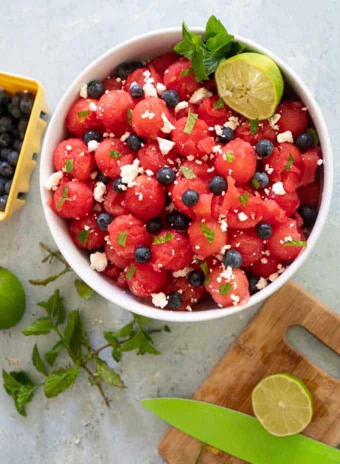 watermelon salad with blueberries mint feta in white bowl